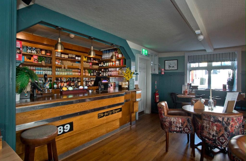 Inside The Lobster — warm pub interior with wooden beams